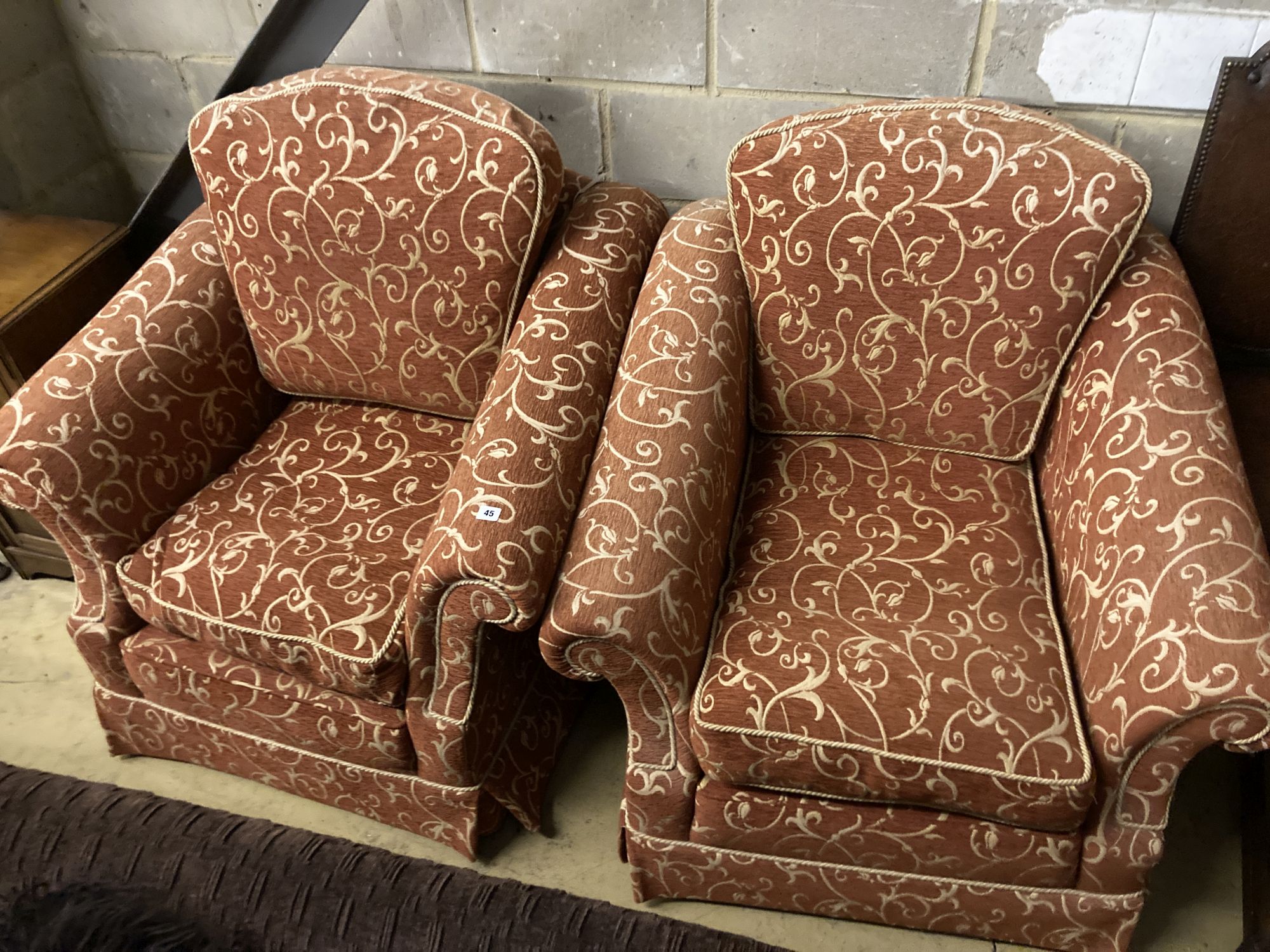A pair of contemporary upholstered armchairs, width 96cm depth 100cm height 96cm